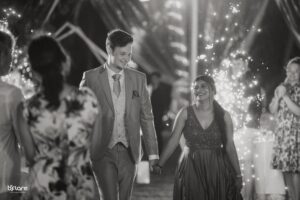 Black and white wedding photography of bride and groom sharing a moment with natural expressions